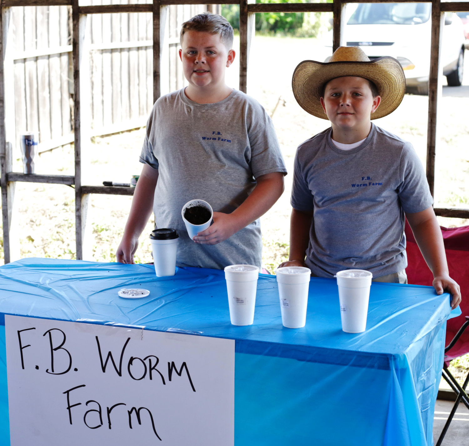 Proprietors Landon Burns (10) and Walker Fannin (11) had already bagged $30 in sales by mid-morning of the June 13 Hawkins Farmers Market.